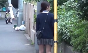 Asian cosset pees publicly